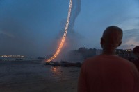 This Fiery Ladder Climbs half A Kilometer Into The night time Sky