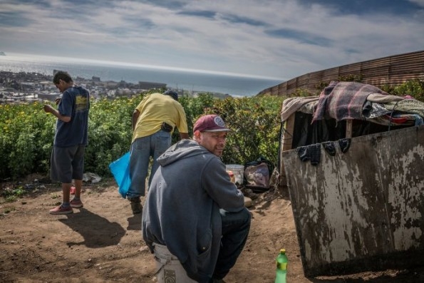 These Photos Take You Into The Makeshift Community Pressed Against The Border Wall | DeviceDaily.com