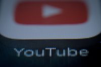 Companies pull ads from YouTube over comments in child videos