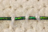 Color-changing fibers make compression bandages easier to use