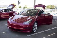 Tesla is hand-delivering the Model 3 to speed up sales