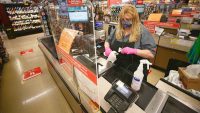 Grocery stores are starting to end hazard pay, but grocery workers are still getting sick