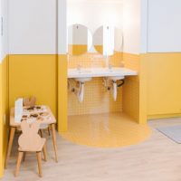 Work peacefully with your kid in the next room? This sleek coworking space is selling exactly that