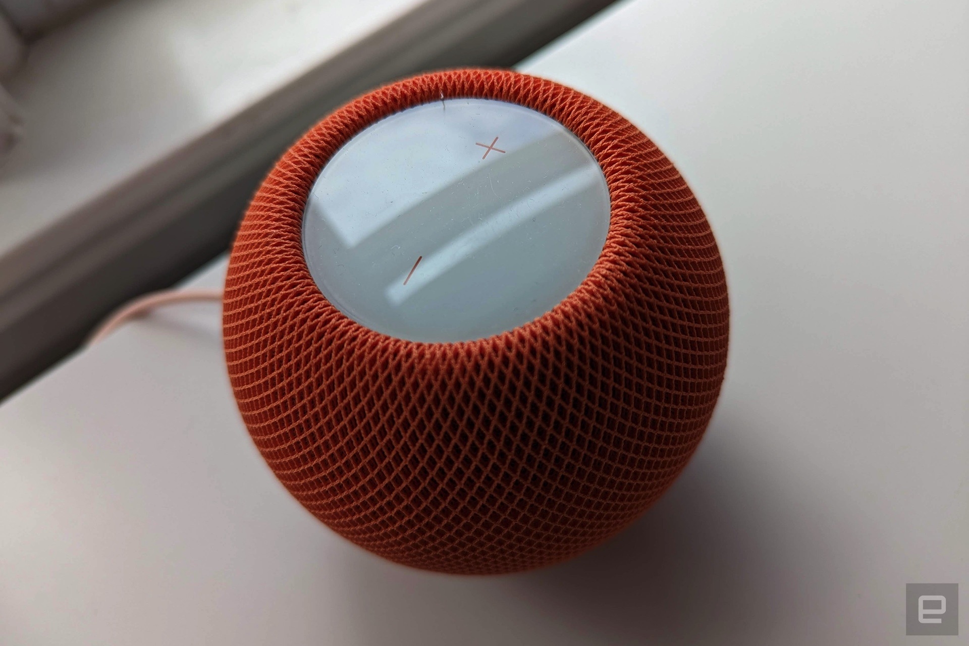 Apple HomePod mini in orange | DeviceDaily.com