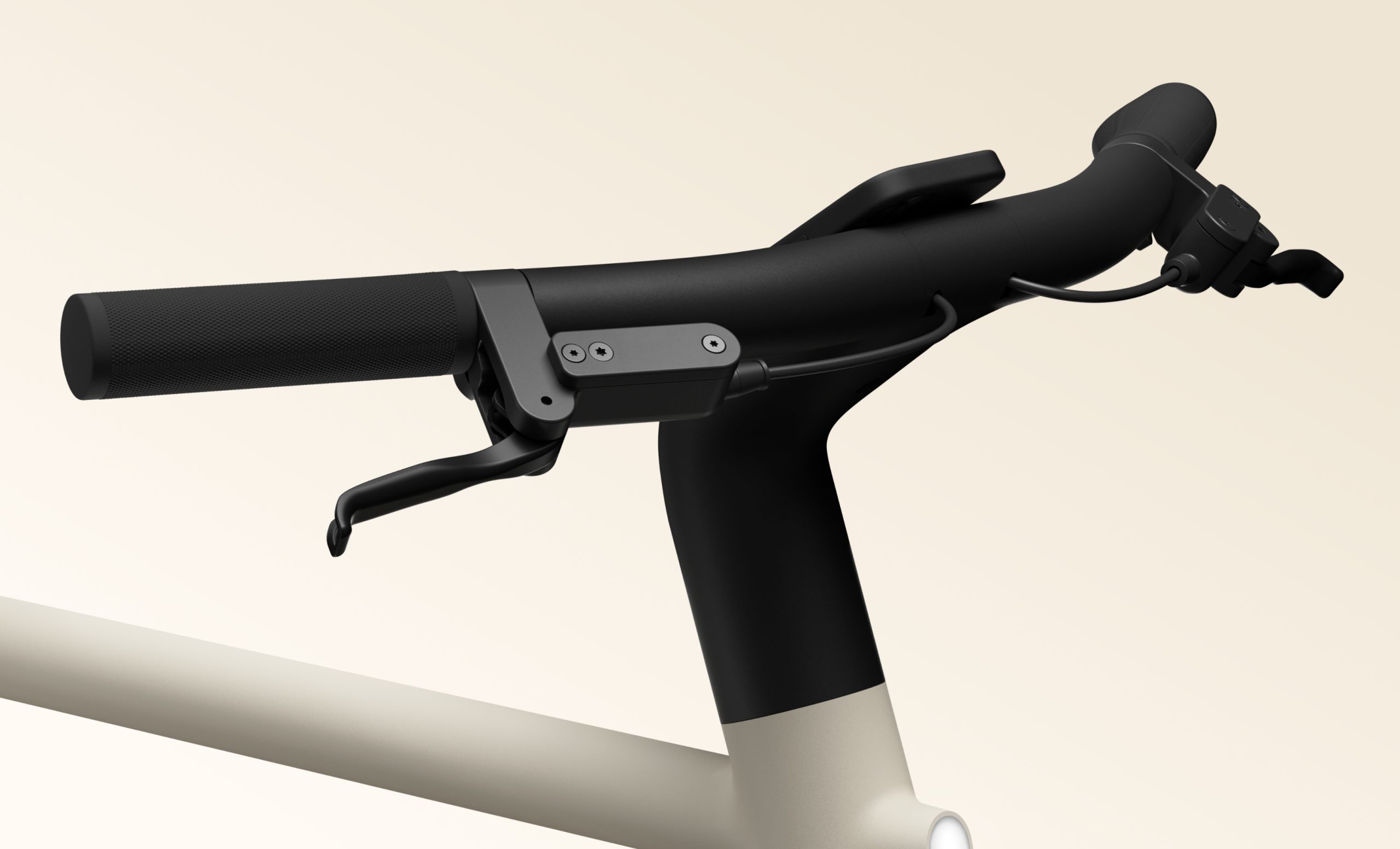 Front-side view of the Cowboy Cruiser e-bike handlebars. A phone is mounted in the center. | DeviceDaily.com