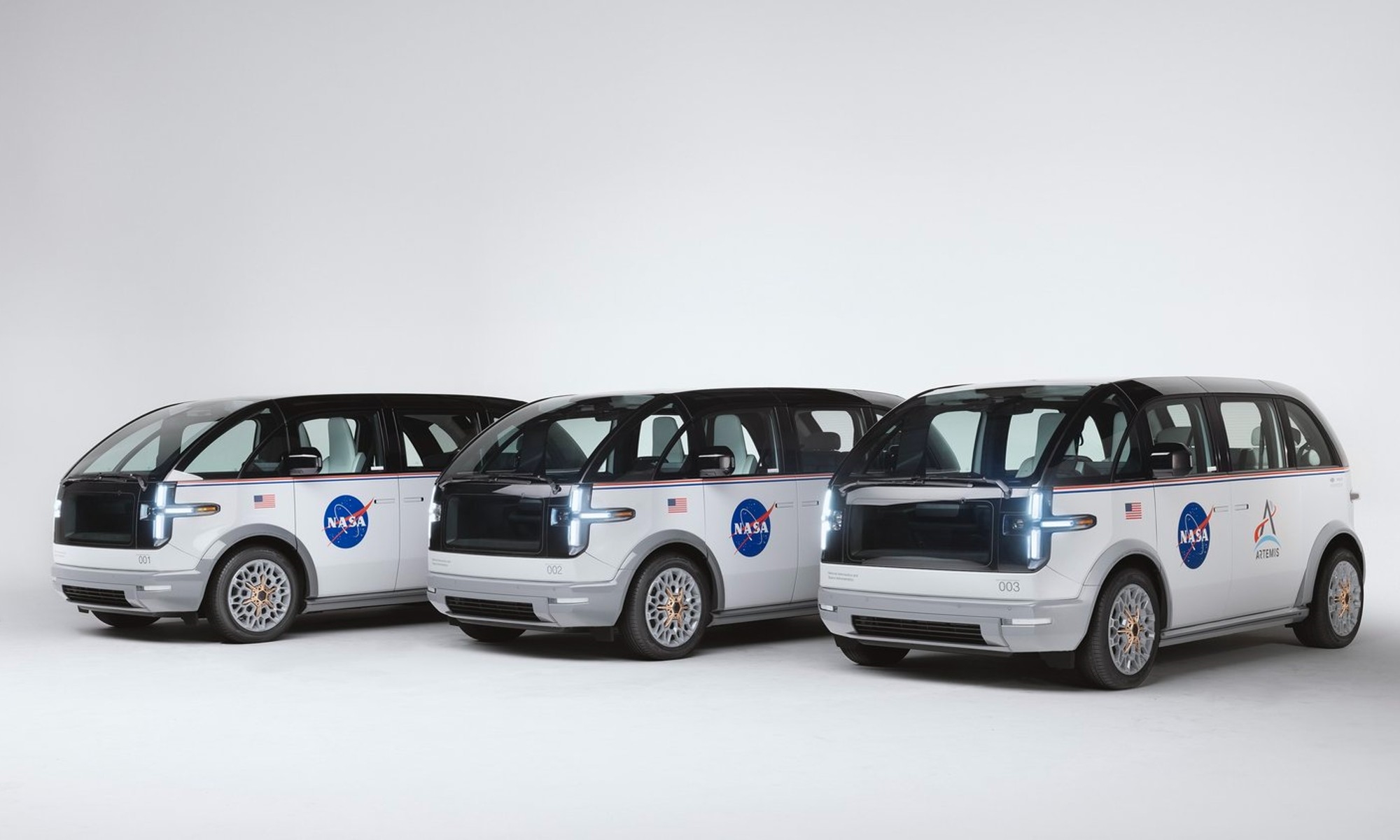 A group shot of Canoo's NASA vans. | DeviceDaily.com