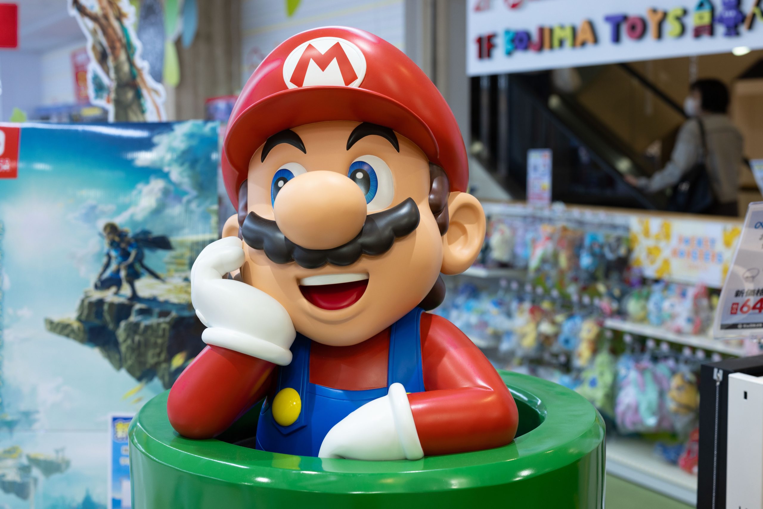 The NES at 40: Seven ways it changed the gaming world forever | DeviceDaily.com YOKOHAMA, KANAGAWA, JAPAN - 2023/05/10: Nintendo's Super Mario figurine at a toy store entrance in Yokohama. A recently released animated film called The Super Marios Bros. Movie has enjoyed huge success and is now the fourth-highest grossing animated film ever. (Photo by Stanislav Kogiku/SOPA Images/LightRocket via Getty Images) | DeviceDaily.com