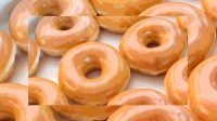 Krispy Kreme locations will give you a free dozen donuts today, but you might want to hurry
